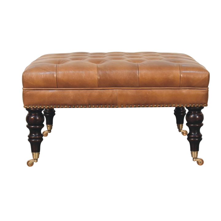 Sussex Studded Leather Ottoman in Blonde Saddle, front view. Blonde saddle hide leather, deep-buttoned top, stud edging.