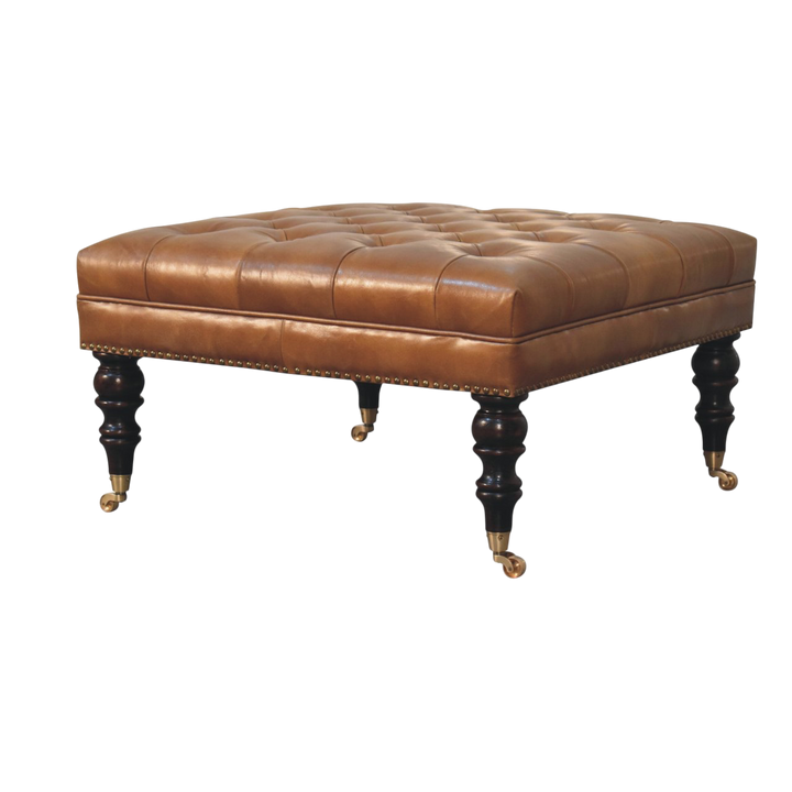 Sussex Studded Leather Ottoman in Blonde Saddle, three-quarter view showing the full profile.