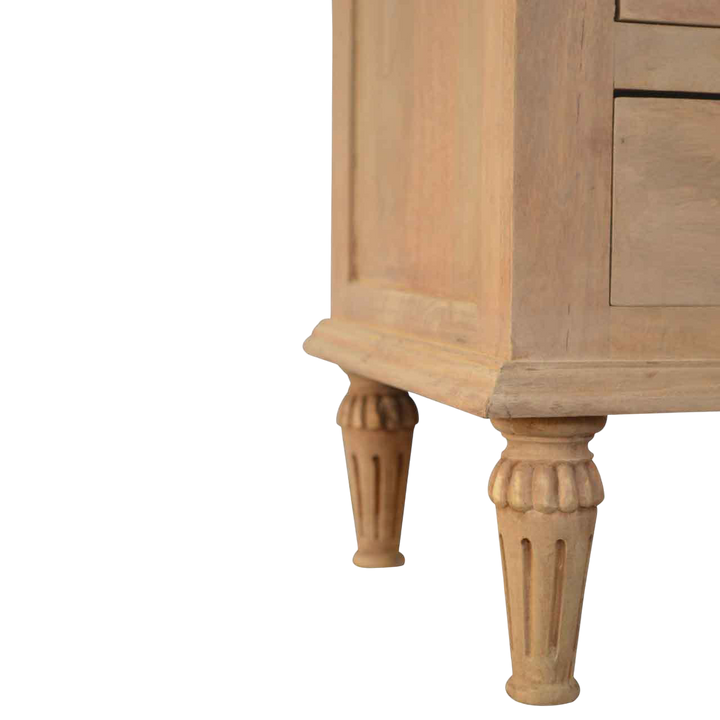Close view of the turned legs on the Trosa Bedside Table in Almond.