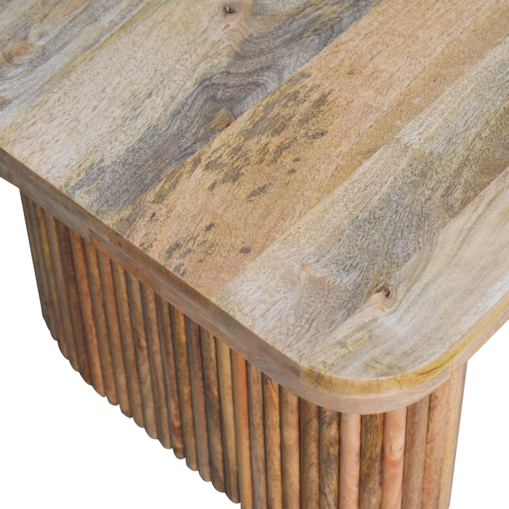 Close view of the carved detailing on the Trosa Block Bench in Amber.