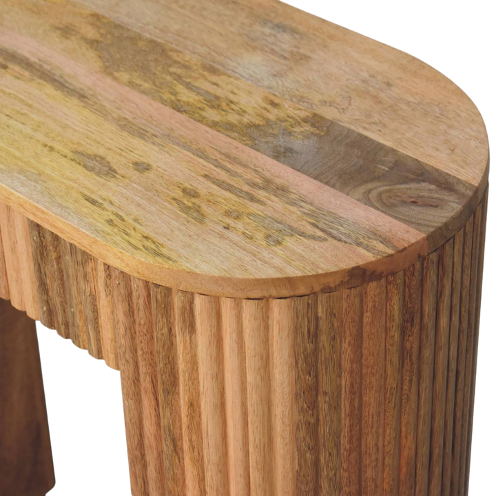 Close view of the carved detailing on the Trosa Block Console Table in Amber.