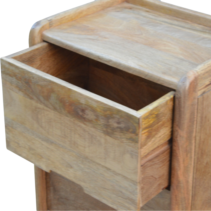 Trosa Gallery-Back Bedside Table in Amber, shown with a drawer open.