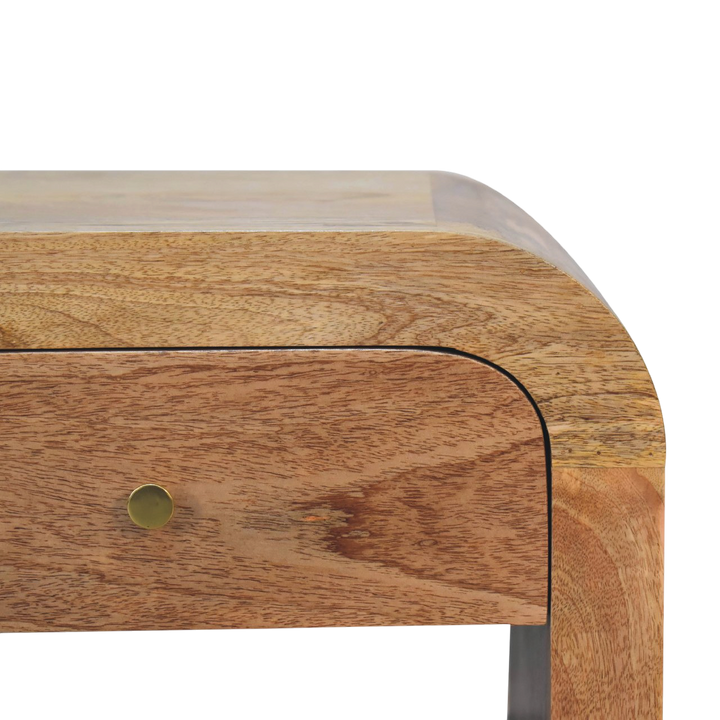Close view of the brass hardware on the Trosa Mini Bedside Table in Amber.