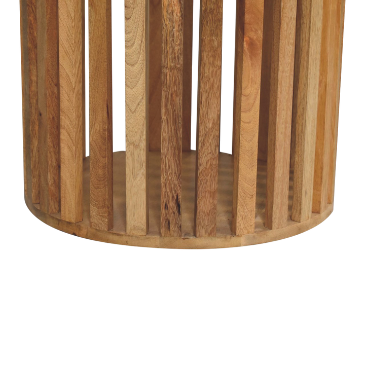 Close view of the base on the Trosa Round Dining Table in Amber.