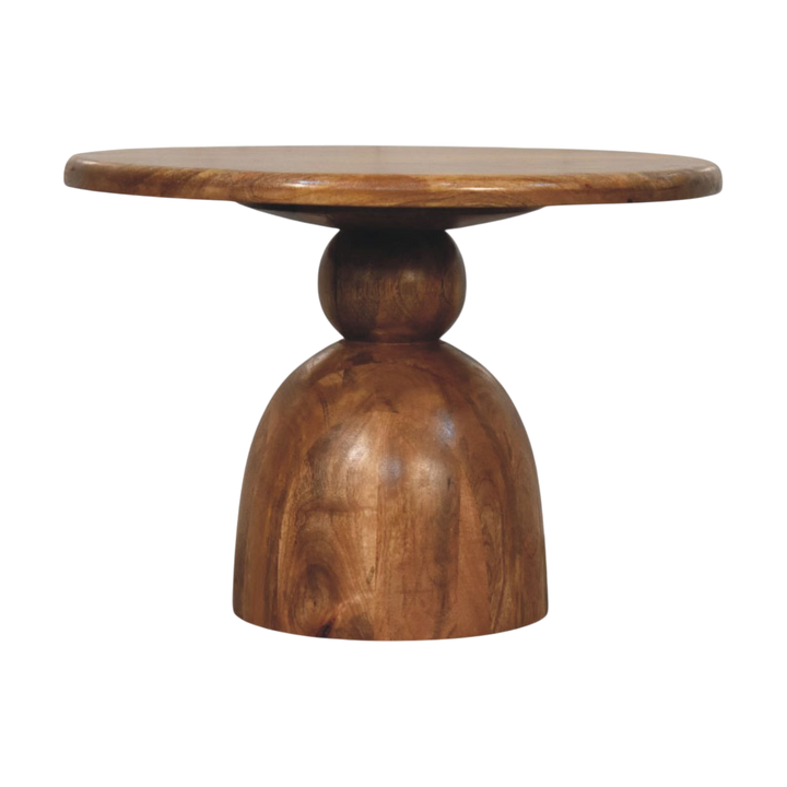 Vallauris Pedestal Coffee Table in Amber, front view. Round hardwood top on a contoured pedestal in a golden amber finish.