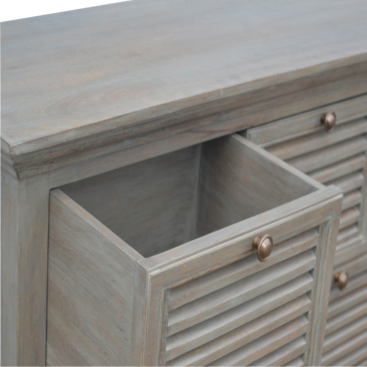 Ventnor Shutter Buffet in Stone, shown with a drawer open.