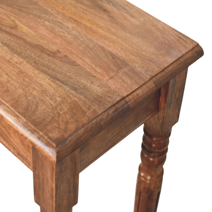 Close view of the top on the Wetherby 3-Drawer Console in Amber.
