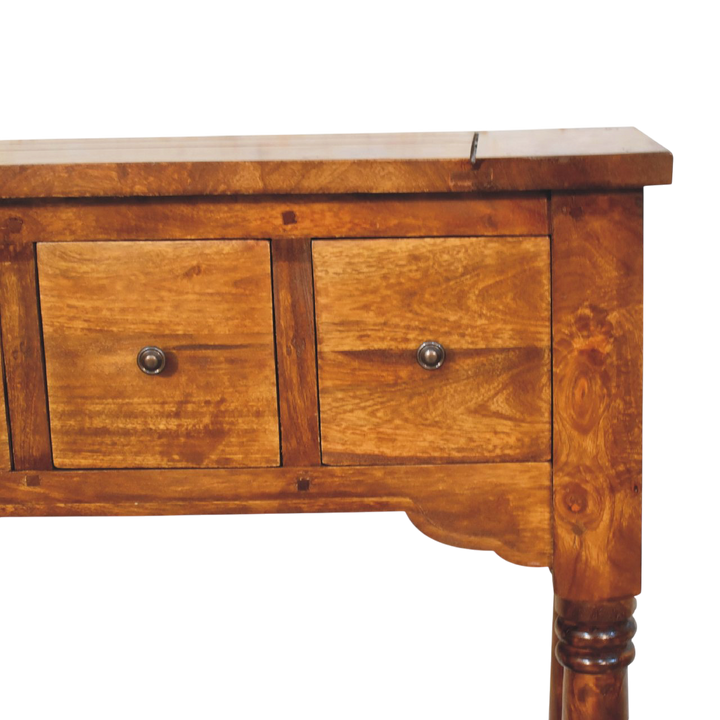 Close view of the drawer front on the Wetherby 4-Drawer Console Table in Chestnut.