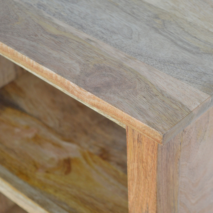 Close view of the shelf on the Wetherby Mini Bookcase in Amber.