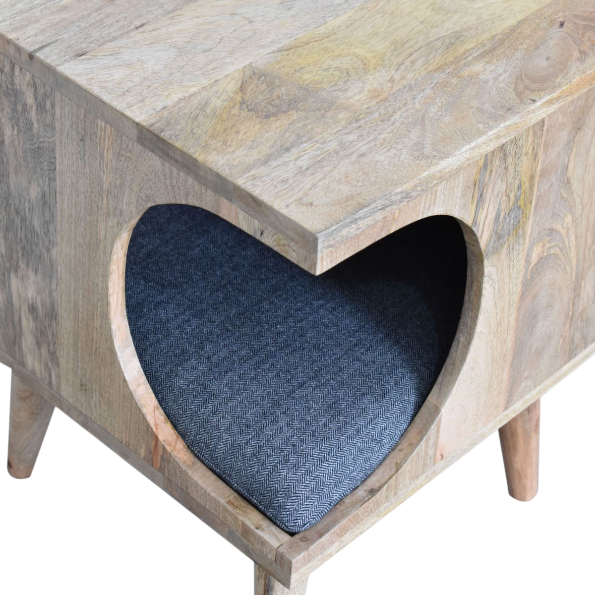 Close view of the carved detailing on the Windsor Cut-Out Pet Bed in Amber with Charcoal Tweed.