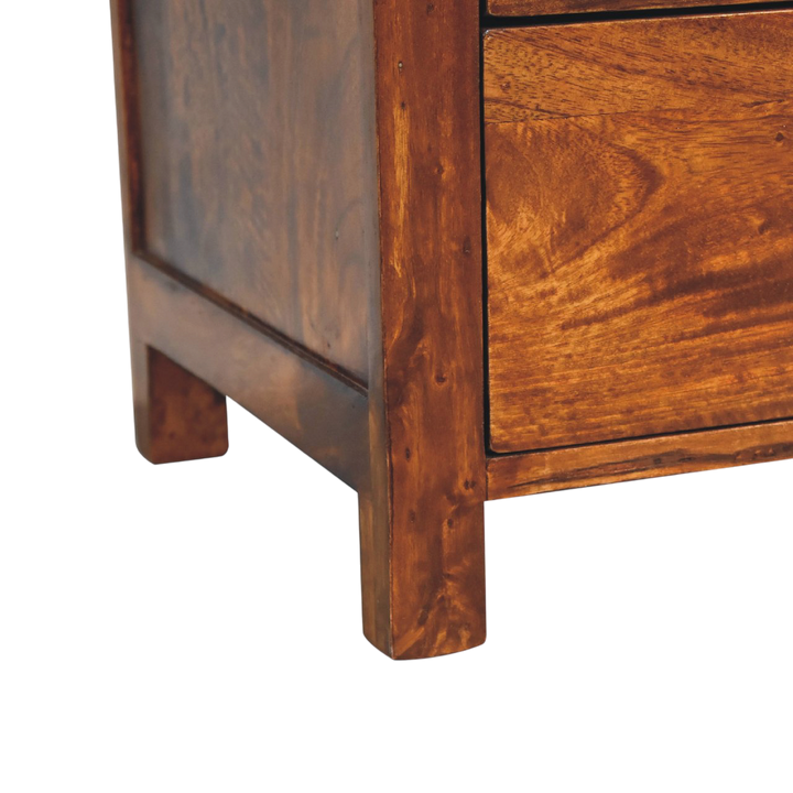 Close view of the base on the Winton 3-Drawer Bedside Table in Chestnut.